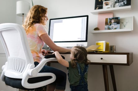 A girl interrupting her mother who is working from home.