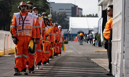 Pit marshals line up at the Mexico Grand Prix.