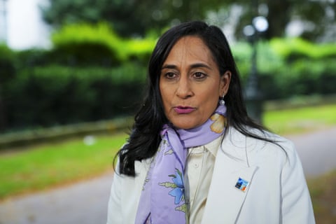 A woman with a purple a scarf.