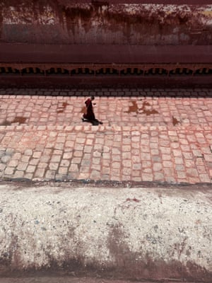 Sakya monastery, Tibet ‘We were walking around the ramparts and I noticed a young monk on his phone. I love the textures and the colours of the monastery walls, which are coated in yoghurt paint.’