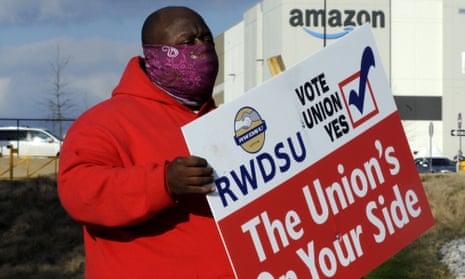 Michael Foster of the Retail, Wholesale and Department Store Union shows the union’s support for Amazon workers in Bessemer, Alabama. 