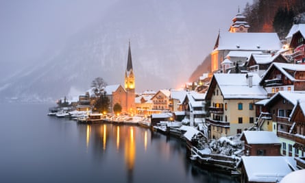 snowy lakeside village at dusk