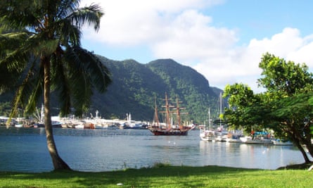 A sailing ship stands in the harbor at Pago Pago, capital of American Samoa.