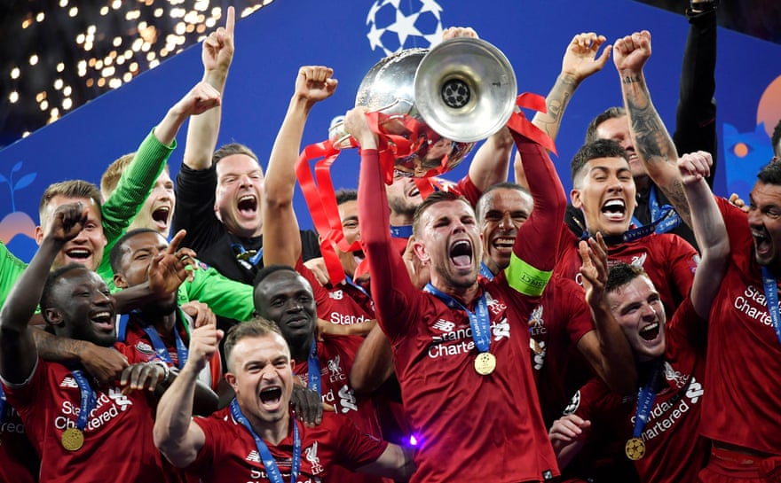 Joy for Jordan Henderson as he lifts the Champions League trophy in 2019.