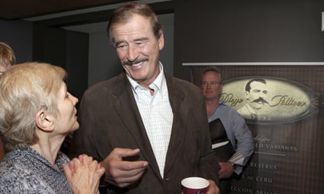 Former president of Mexico Vicente Fox talks with Tana Lee Tolson from Nurses Union for Cannabis Hospices before a news conference held by commercial marijuana company in Seattle, Washington, in May 2013.