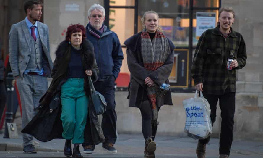 Defendants Rhian Graham (second from right) and Milo Ponsford (right) return to Bristol Crown Court after lunch on the closing day of arguments.