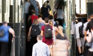 Office workers enter a building in Brisbane
