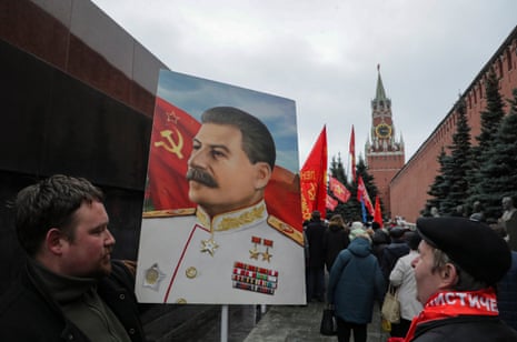 Communist party and ‘Left Front’ supporters carry flags and a portrait of Soviet leader Joseph Vissarionovich Stalin, as they attend a flower-laying ceremony at the Lenin mausoleum.