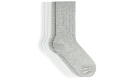 Several pairs of ribbed ankle socks in white and grey