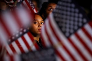 An attendee reacts to early election results at Howard University