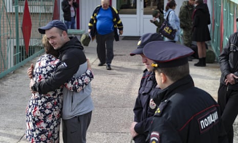 A Russian recruit hugs his mother at a military recruitment centre in Volgograd, Russia, Saturday, Sept. 24, 2022. 