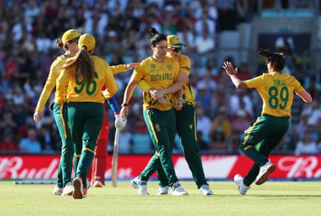South Africa's Marizanne Kapp celebrates with teammates after taking the wicket of England's Danni Wyatt Hodge.