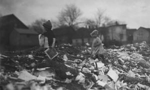 Black and white image of children going through Whitman Street dump.