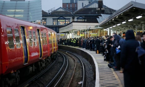 Commuters on a platform at Clapham Junction