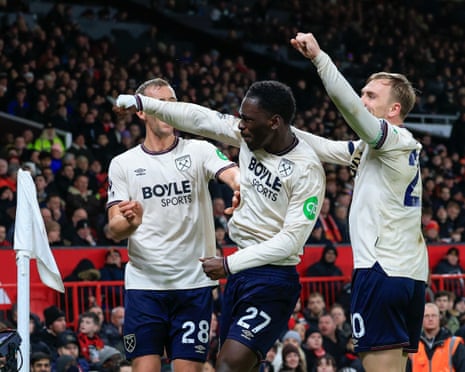 Soungoutou Magassa (centre) celebrates his late equaliser at Old Trafford.