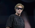 Person wearing black shirt and black tinted glasses