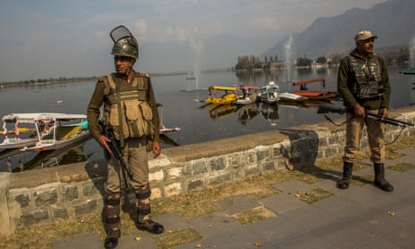 Indian forces stand guard on the bank of Dal lake, in Srinagar, the summer capital of Indian-administered Kashmir.