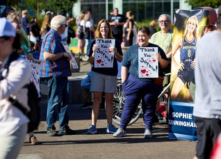 People rally to support Indiana Fever guard Sophie Cunningham after her comments on transgender athletes in women’s sports before a WNBA game between the Portland Fire and the Indiana Fever on Friday.