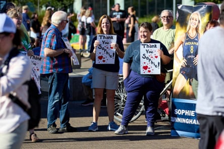 people hold signs that say âÂÂthank you SophieâÂÂ