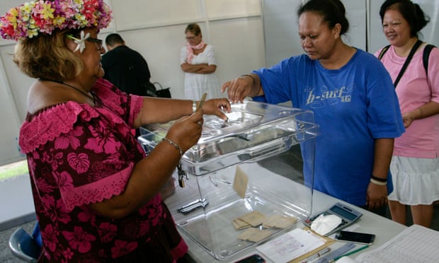 Woman casts her vote in Tahiti.
