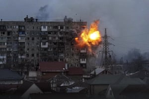 An explosion at an apartment building after Russian army tanks fired at Mariupol