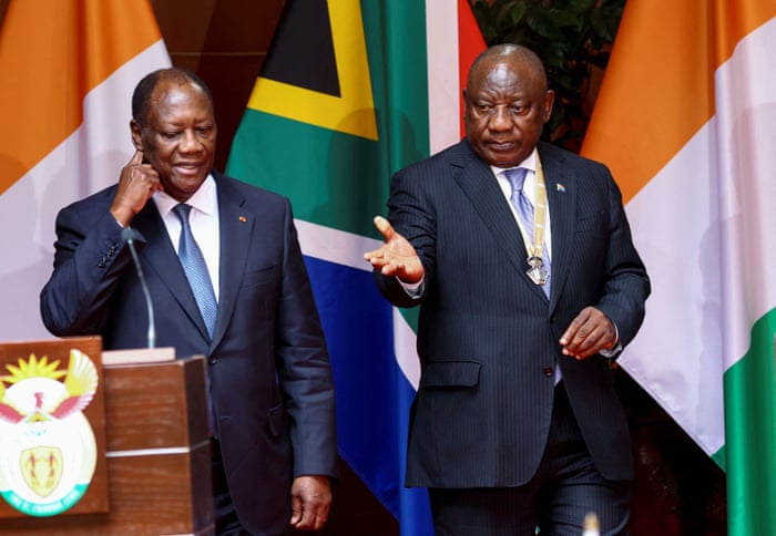 Ivory Coast president Alassane Ouattara stands next to South African president Cyril Ramaphosa during his state visit at the government’s union building in Pretoria, South Africa, on 22 July 2022.