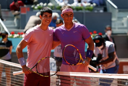 Carlos Alcaraz and Rafael Nadal pose at the Madrid Open in 2021.