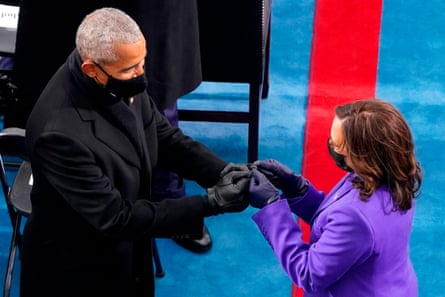 Kamala Harris is greeted by former president Barack Obama during the inauguration.