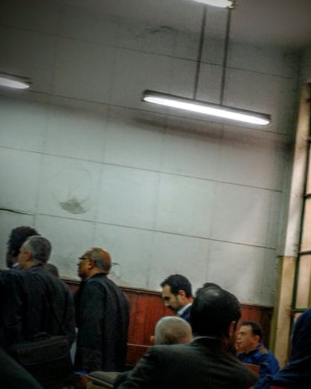 Ahmed Naji (centre background) glimpsed at his court appearance in February 2016.