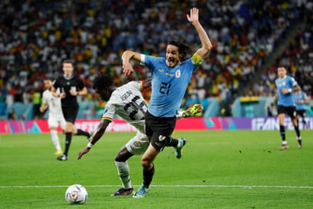 Uruguay’s Edinson Cavani tussles with Ghana’s Seidu Alidu and claimed a penalty which wasn’t given during the Qatar 2022 World Cup Group H match between Ghana and Uruguay.