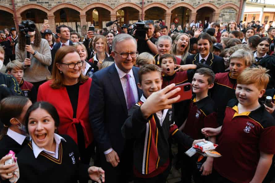 Anthony Albanese takes selfies with students during a visit to Cabra Dominican College in Adelaide.