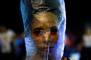 Woman with plastic bag over head