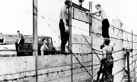 Building commandos of the German Democratic Republic start erecting the wall, August 1961.