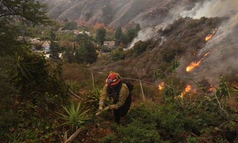 Firefighters deploy structure defense against the Palisades wildfire in Los Angeles, California, USA, 11 January 2025. Thousands of firefighting and emergency personnel are involved in response efforts, as multiple wildfires continue to burn across thousands of acres in Southern California, destroying thousands of homes and forcing people to evacuate areas throughout the Los Angeles area. EPA/ALLISON DINNER