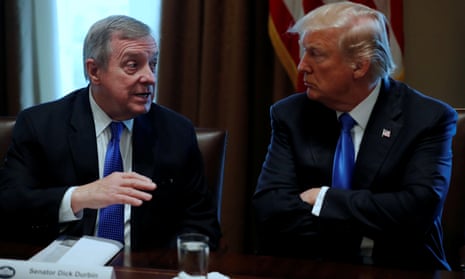 Donald Trump listens to Senator Dick Durbin in a meeting at the White House.