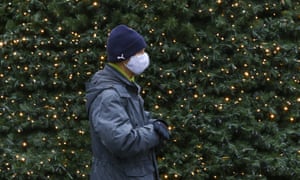 A man wearing mask walks at a street in Berlin, Germany on December 1, 2020.