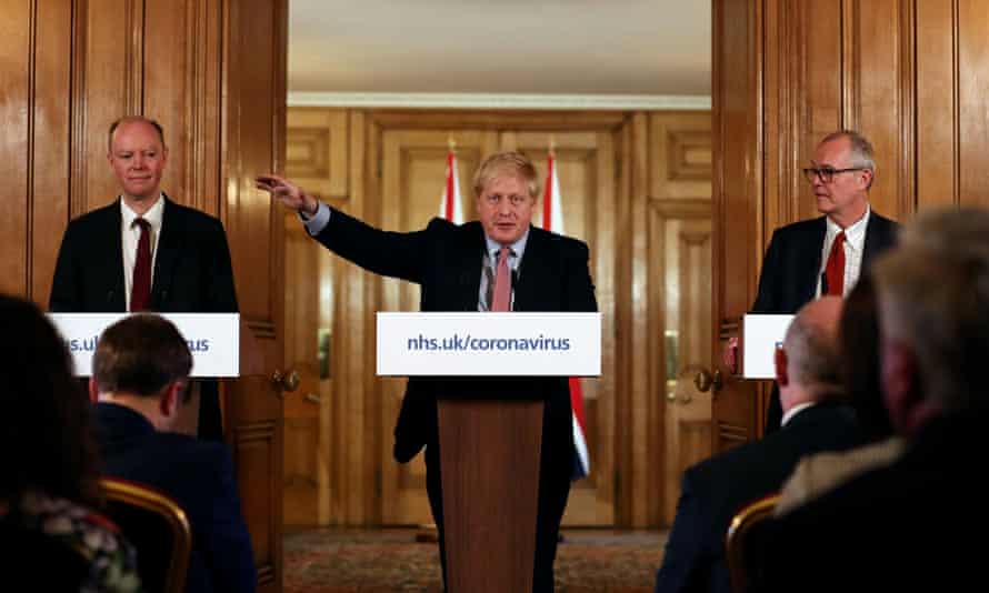 From left: chief medical officer for England, Chris Whitty; Boris Johnson; and chief scientific adviser Sir Patrick Vallance attend a news conference.