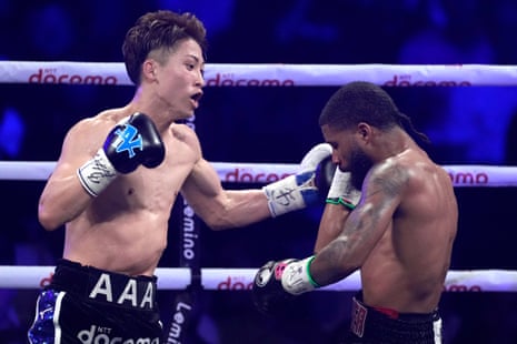 Naoya Inoue, left, throws a punch against Stephen Fulton during the fourth round of Tuesday’s fight.