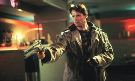 film still of man in baggy coat with a gun