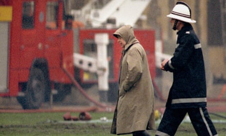 The Queen surveys the scene at Windsor Castle after the fire in 1992.