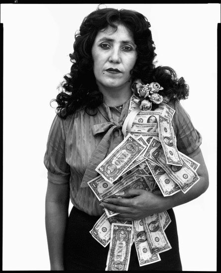 Black and white image of Petra Alvarado, factory worker, El Paso, Texas, April 22, 1982, with dollar bills pinned to her chest