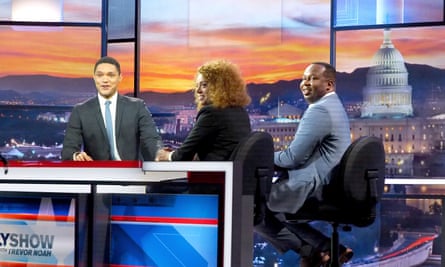 Trevor Noah, Michelle Wolf and Roy Wood Jr seated at desk