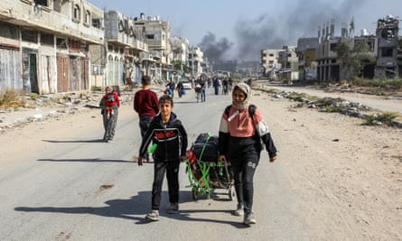 Displaced Palestinians flee the northern part of Gaza amid an Israeli military operation in Gaza City, 12 November 2024.