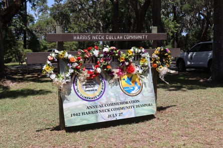 sign with floral wreaths