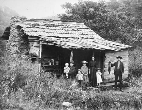 Family standing in front of cabin, near Mt. Sterling, North Carolina