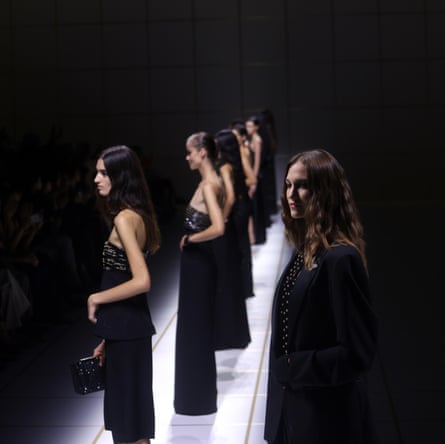 Models present creations from Armani’s women’s spring/summer 2027 collection at Milan fashion week.