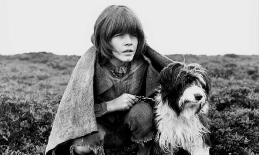 The Water BabiesActor Tommy Pender with his dog, in a scene from the film ‘The Water Babies’, 1978. (Photo by Stanley Bielecki Movie Collection/Getty Images)