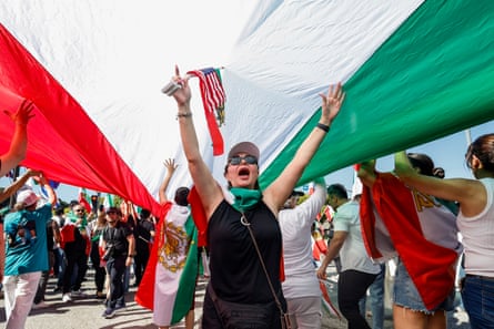 Demonstrators wave flags in celebration following the US and Israeli strikes in Iran; in Los Angeles.