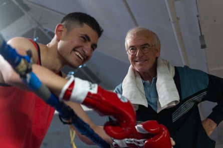 Pierce Brosnan as Brendan Ingle in the ring with Amir El-Masry as Naseem Hamed