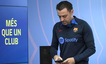 The Barcelona manager and former player, Xavi, arrives for a press conference before the visit of Real Madrid